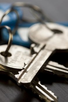 Macro Shot of Conceptual House Keys on Top of Wooden Table