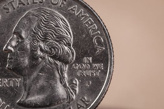 US American coin with wording "in God we trust"