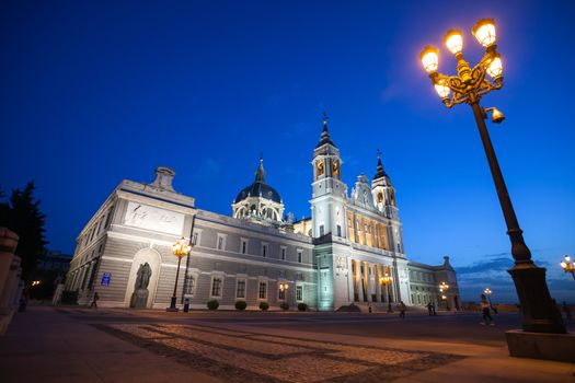 Madrid, Spain - May 10, 2012: Cathedral Almudena with tourists on a spring night in Madrid, Spain