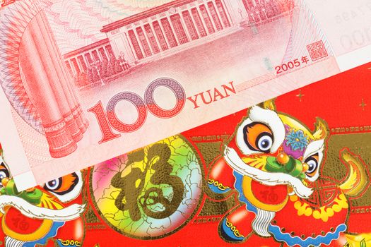 Chinese or 100 Yuan banknotes money in red envelope, as chinese new year background