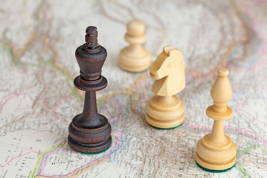 Chess figures on a historical map