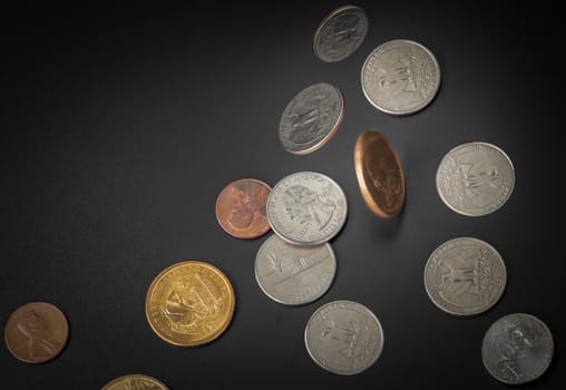 American coin falling on black background