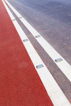 road stud with white reflector and red path