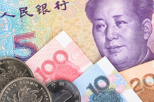 Chinese or Yuan banknotes money and coins from China's currency, close up view as background