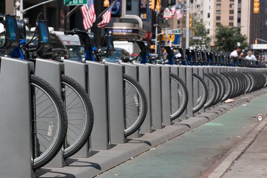 New York - Aug 20: several bicycles from city bike parked in a row waiting to be hired  in downtown New York on August 20, 2014 in New York, USA