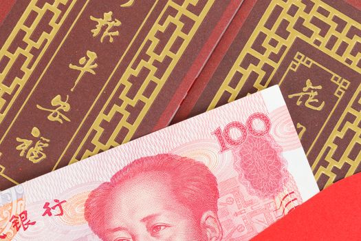 Chinese or 100 Yuan banknotes money in red envelope, as chinese new year background