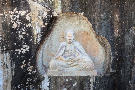 SAKONNAKHON THAILAND - NOVEMBER 28: The famaus monk names "Khru Ba Sri Vi Chai", at Temple names "Wat Thum Pha Dan" in Sakonnakhon, Thailand on November 28, 2014