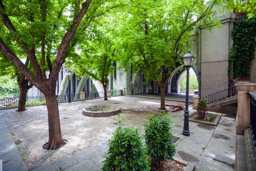 Madrid, Spain - May 6, 2012: Small park near Segovia Viaduct on spring in the city of Madrid, Spain
