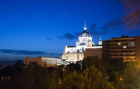 Madrid, Spain - May 10, 2012: Pope John Paul II statue in front of Cathedral Almudena on a spring night in Madrid, Spain