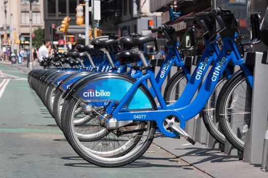 New York - Aug 20: several bicycles from city bike parked in a row waiting to be hired  in downtown New York on August 20, 2014 in New York, USA