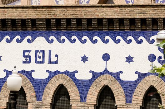 Architectural details of mosaic building wall in Madrid Spain