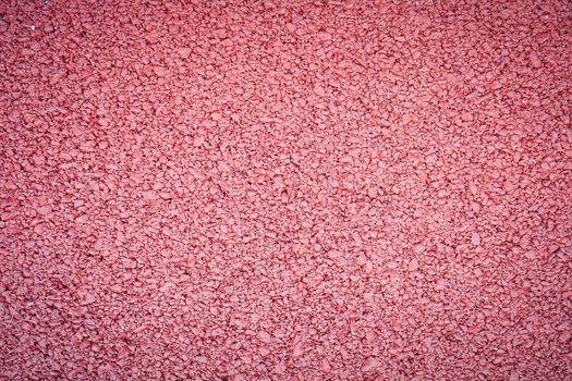 background texture of rough red asphalt