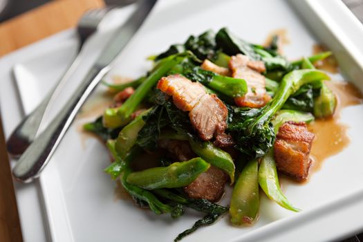 Thai style crispy pork dish with Chinese broccoli.