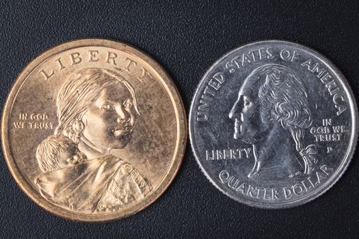 US American coin with wording "in God we trust" on black background