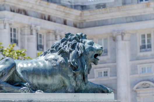 Sculpture of a laying lion in Madrid Spain