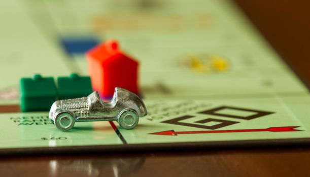 BOISE, IDAHO - NOVEMBER 18, 2012: Car from the game Monopoly speeding past. Game was made by Parker Brothers now owned by Hasbro