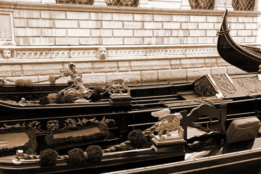 Italy. Venice. Details of typical venitian gondolas. The winged lion and golden horse on a venetian gondola. In Sepia toned. Retro style