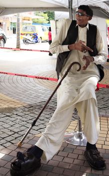 Kota Kinabalu, Borneo, Malaysia - December 31, 2014: Ajaz (Ijaz) Ahmed (1976) Pakistani farmer. Claims to be the tallest man in the world with an increase of 2.54 m. in Kota Kinabalu, Borneo. Malaysia