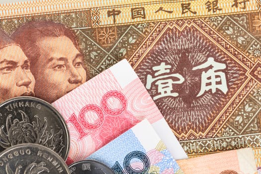 Chinese or Yuan banknotes money and coins from China's currency, close up view as background