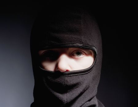 Portrait of a Boy with Hood Playing Ninja