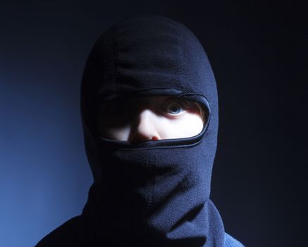 Portrait of a Boy with Hood Playing Ninja