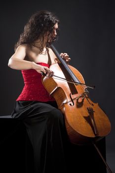 Young Woman in Red Top Playing Violoncello