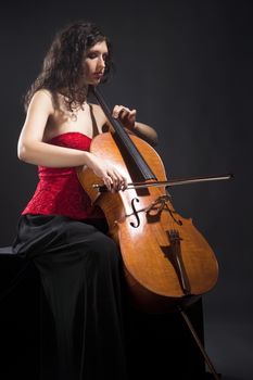 Young Woman in Red Top Playing Violoncello