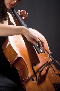 Closeup of a Female Musician Playing Violoncello