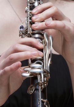 Hands of Young Female Musician Playing Clarinet