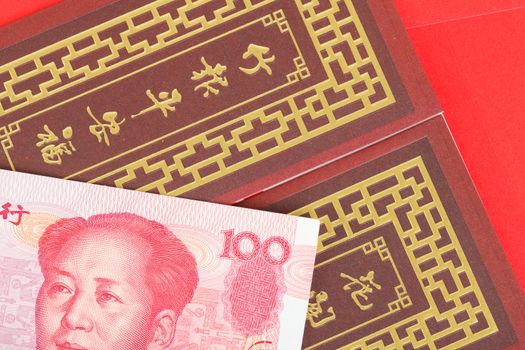 Chinese or 100 Yuan banknotes money in red envelope, as chinese new year background