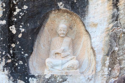 SAKONNAKHON THAILAND - NOVEMBER 28: The famaus monk names "Somdet Toh" or "Somdet Budhacariya (Toh Brahmaransi) carved from stone, at Temple names "Wat Thum Pha Dan" in Sakonnakhon, Thailand on November 28, 2014