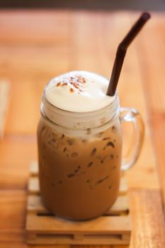 Iced caffe mocha with milk foam, stock photo