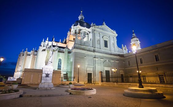 Madrid, Spain - May 10, 2012: Pope John Paul II statue in front of Cathedral Almudena on a spring night in Madrid, Spain