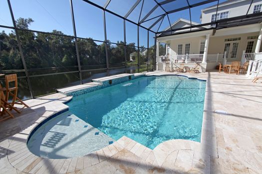 A swimming pool area at a large home