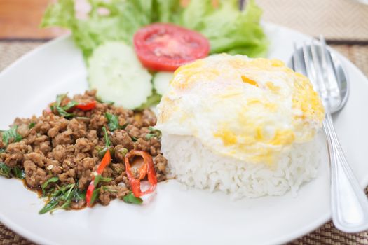 Thai spicy food basil pork fried rice with fried egg, stock photo