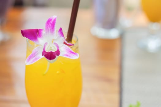 Glass of iced orange juice, stock photo