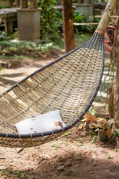 Vintage stylized hammock in garden, stock photo