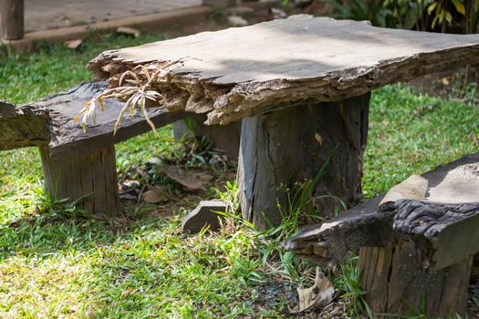 Wooden table decorated in garden, stock photo