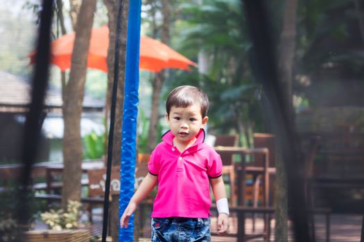 Asian boy relax in the park, stock photo