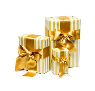 Gold gift boxes isolated on white background