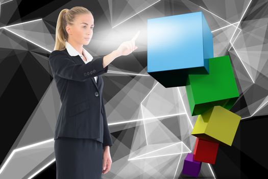 Businesswoman pointing against abstract glowing black background