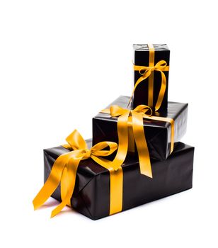 Black gift box with yellow satin ribbon and bow