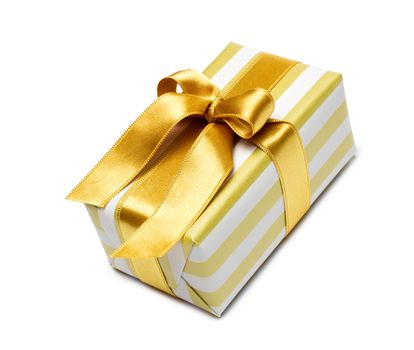 Gift box in gold duo tone with golden satin ribbon and bow isolated over white background.