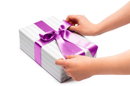 hand holding ribbon and open gift box