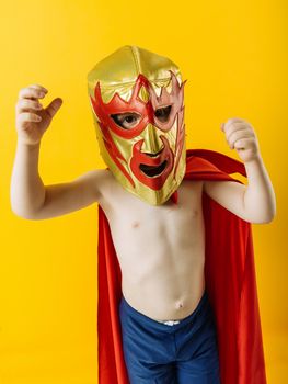Photograph of a 4 year-old dressed as a Mexican wrestler or Luchador.
