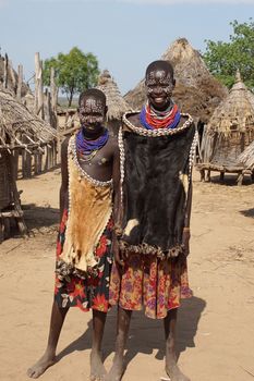 TURMI, ETHIOPIA - NOVEMBER 19, 2014: Karo children with traditional clothings and necklace on November 19, 2014 in Turmi, Ethiopia.