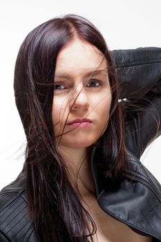 Portrait of a Young Woman in Leather Jacket - Isolated on Gray