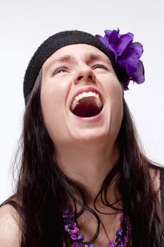 Young Woman with Spontaneous Toothy Laughter - Isolated on White