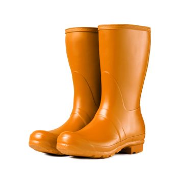 Yellow rubber boots isolated on white