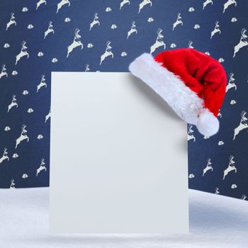 Santa hat on poster against blue reindeer pattern